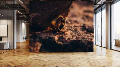 wedding rings on the ground Wall mural