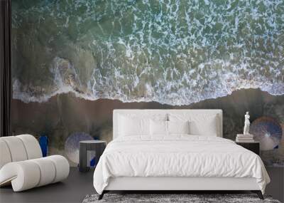 Beach, beautiful waves, blue water at sunrise. Top view from drone. Wall mural