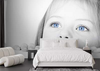 Close up on a beautiful blue eyes of a young girl Wall mural