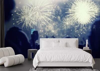 New Year concept - cheering crowd and fireworks Wall mural