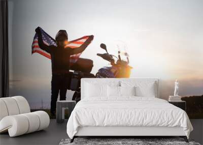 Patriot man holding the american flag on the 4th of July Wall mural