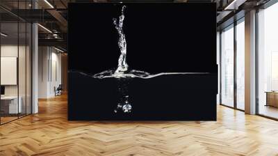 Splash on water surface isolated on black background, close up view. Drop falling into liquid. Bubbles underwater. Ready to use blending mode to screen or add Wall mural