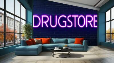 Drugstore word lettering glowing with neon light on dark brick wall background Wall mural