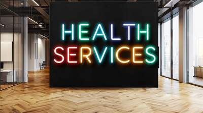 Health Services colorful neon lettering on plain black dark background Wall mural