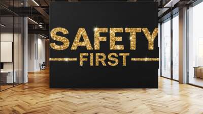 safety first word lettering with glitter gold shining effect on plain black background Wall mural