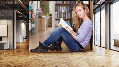 happy female student in library looking at camera Wall mural