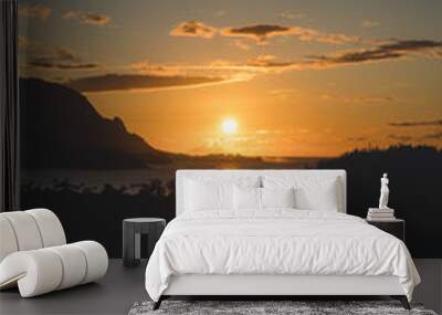 sunset over the sea with mountain background and vibrant sky Wall mural