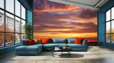 Fiery orange sunset sky. Beautiful sky during sunset. Wall mural