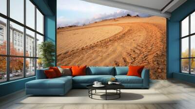 motocross and auto sport track on blue sky background. wheel tra Wall mural