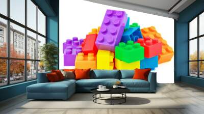 Toy colorful plastic blocks on white background Wall mural