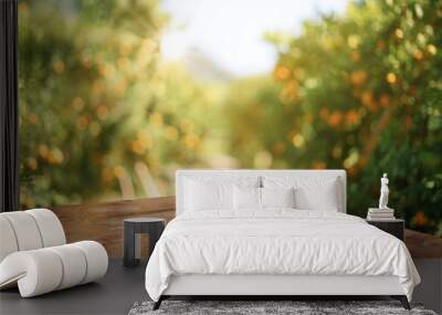 Empty wood table with free space over orange trees, orange field background. For product display montage Wall mural