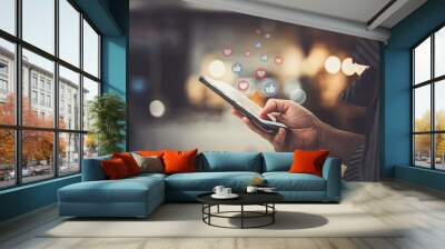 hand using smartphone with social media concept. Wall mural