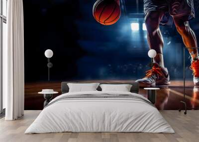 Closeup of legs of a professional basketball player in a sport hall with dramatic light. Copy space Wall mural