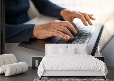 Senior person typing on laptop, closeup of wrinkled hands Wall mural