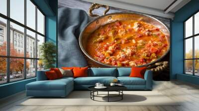 Famous Turkish menemen dinner on table, made by eggs, pepper and tomatoes. Wall mural