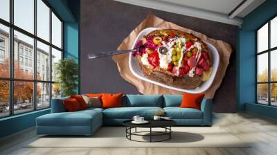 Kumpir, Turkish baked potato with cheese, corn, sausage, ketchup, mayonnaise and olives. This kumpir is traditional turkish food Wall mural