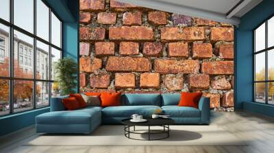 A grunge dirty old brick stone wall exterior. Abstract  brick wall  urban texture. Weathered textured pattern background with copy space for text. Old brick wall in a background. Wall mural