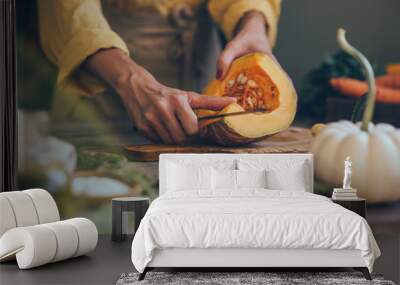 Female hands cutting pumkin on dark wooden kitchen table with vegetables cooking ingredients. Wall mural