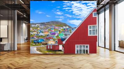 Typical architecture of Greenland city Qarqotoq with colored houses located near fjords and icebergs. Wall mural