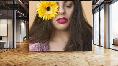 portrait of young woman with flower in her eye Wall mural