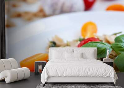 Panoramic view on farfalle aglio olio on a white plate with cherry tomatoes and fresh basil Wall mural