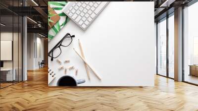 White home office desk. Copy space. Office stuff. Notebook, keyboard, succulent, gray cup with coffee. Place for text. View from above. Wall mural