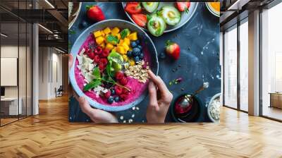 Person preparing a healthy and colorful smoothie Wall mural