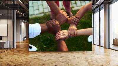 Black people with hands joined. Black people support each other. Wall mural