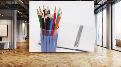 colored pencils in a glass isolated on business background Wall mural