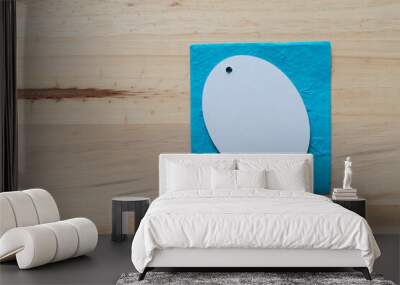 background with oval tag on a blue paper and wood Wall mural