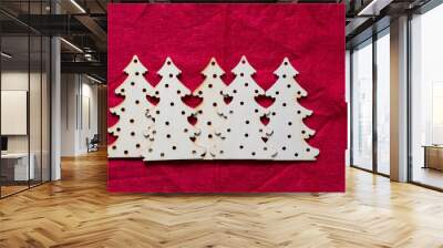 christmas tree shapes on red felt Wall mural