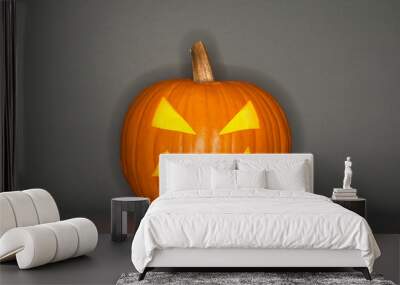 Halloween pumpkin head jack isolated on grey background Wall mural