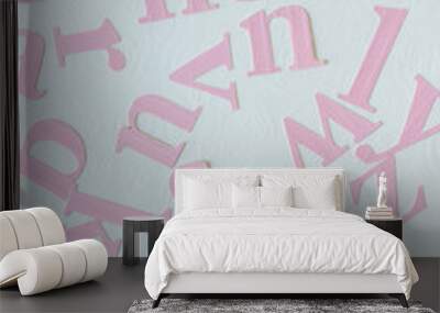 pink letters on embossed paper or high degree of heat and physical contact Wall mural