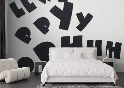 random black paper letters on blank paper Wall mural