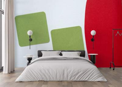 two green paper squares with rounded corners and red shape (shadows at L and R edges are intentional) Wall mural