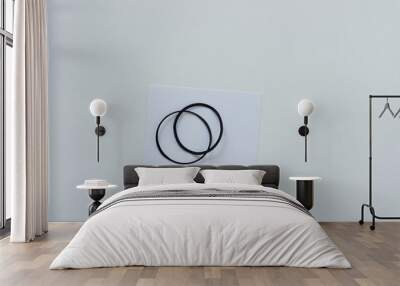 two paper circles or rings isolated on white and blank paper Wall mural