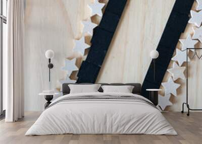 two rows of small black tiles and wood stars Wall mural