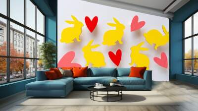 yellow bunnies made of wood) and hearts with 3d effect on paper Wall mural