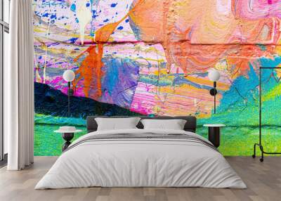 A fragment of colorful graffiti painted on a brick wall. Abstract backdrop for design. Wall mural