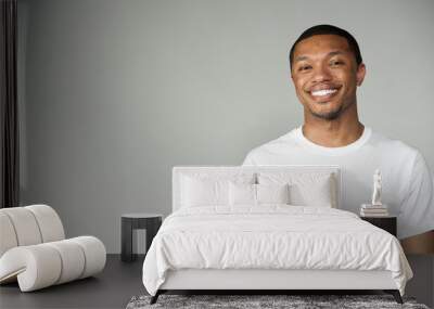 Trendy Happy and Fun Black Male Wearing A White Top Wall mural