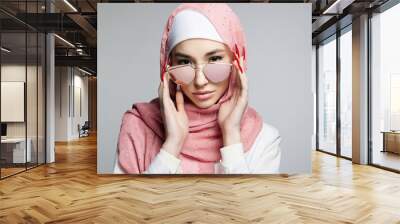 beautiful islamic young woman with long Nails. beauty girl in hijab and sunglasses Wall mural