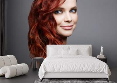 beautiful smiling woman with curly red hair. beauty portrait Wall mural