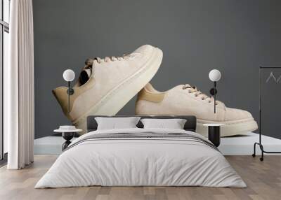 beige sneakers. fashion shoes still life Wall mural