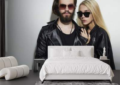 fashion beautiful couple in black leather wearing sunglasses Wall mural