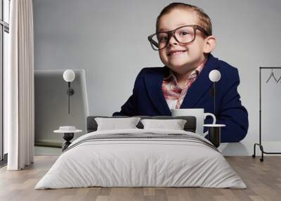 funny child with computer.Young business boy. smiling kid Wall mural