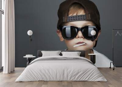 Funny Young Boy Eating A Lollipop.child in sunglasses Wall mural