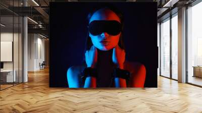 Girl in handcuffs and mask. slave Beautiful young Woman in color lights Wall mural