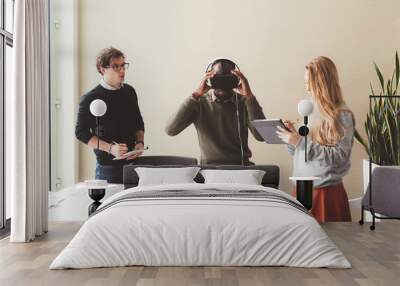 three young people coworkers working indoors using 3d glasses Wall mural