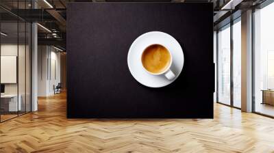 Cup of coffee on black background. Top view. Copy space. Wall mural