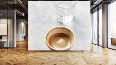 Cup of coffee on bright stone background. Copy space
 Wall mural